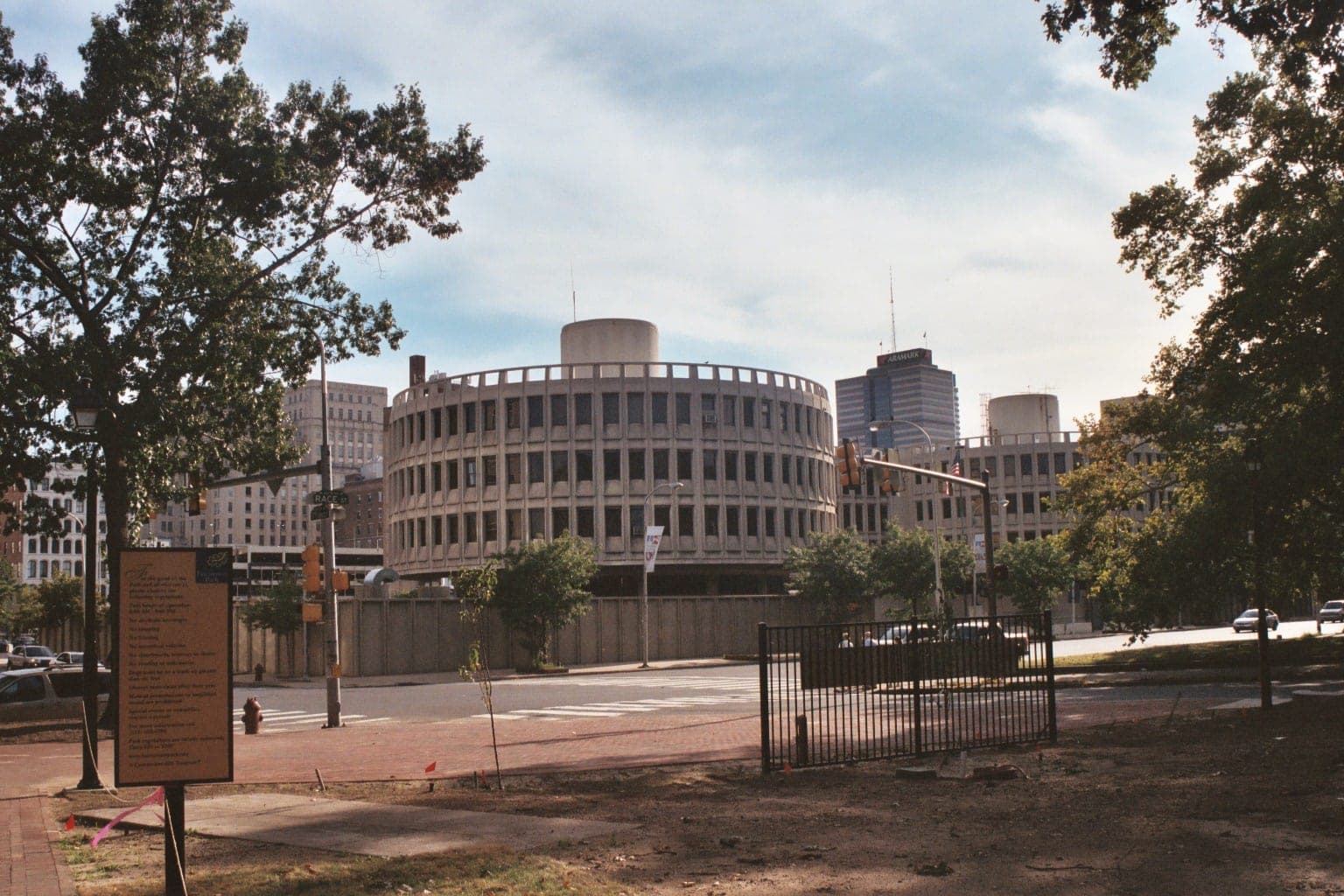 The Roundhouse, the curved concrete building that served for decades as the Philadelphia Police Department's headquarters, seen from across Race Street.