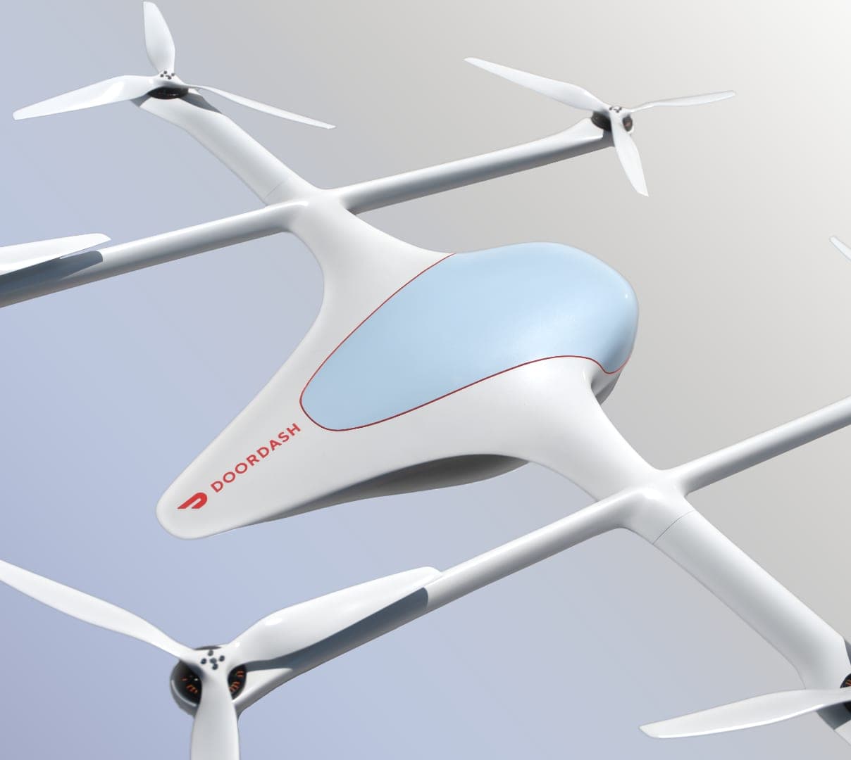 A white six-propeller DoorDash Air delivery drone in flight, viewed from below at an angle