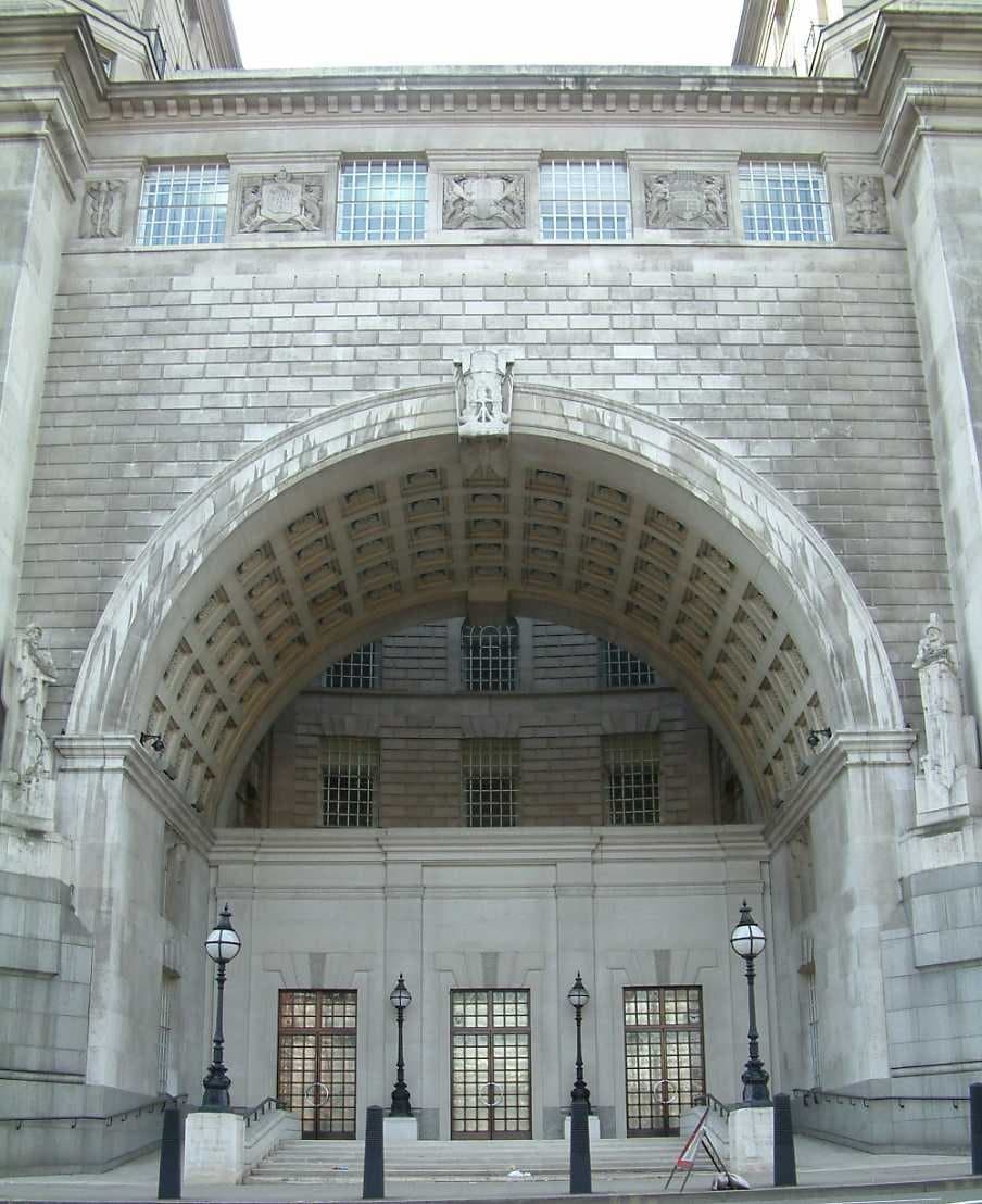 The stone archway entrance of Thames House, MI5's headquarters building in London