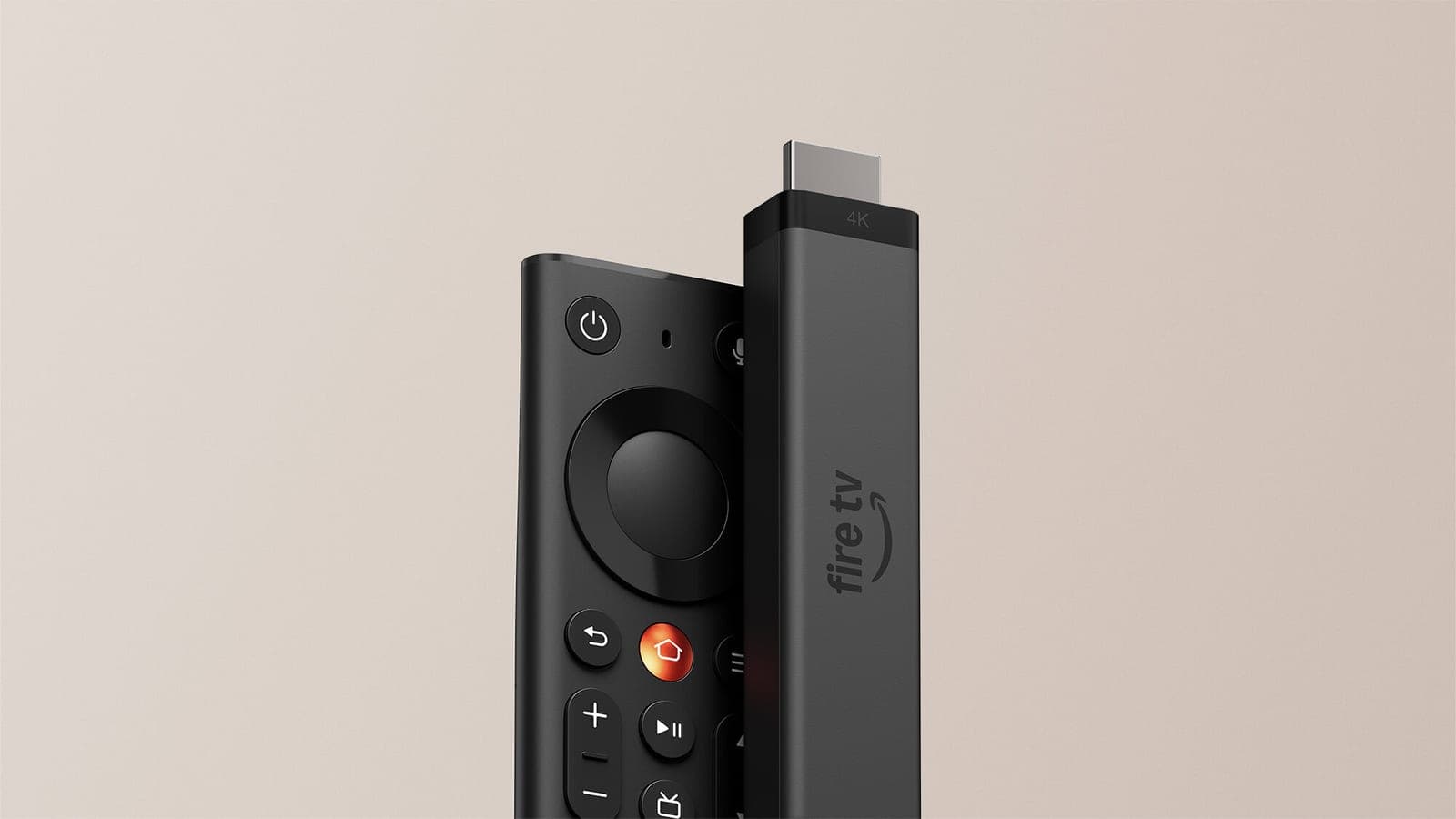 Amazon's new Fire TV Stick 4K plugged into its redesigned remote against a beige background