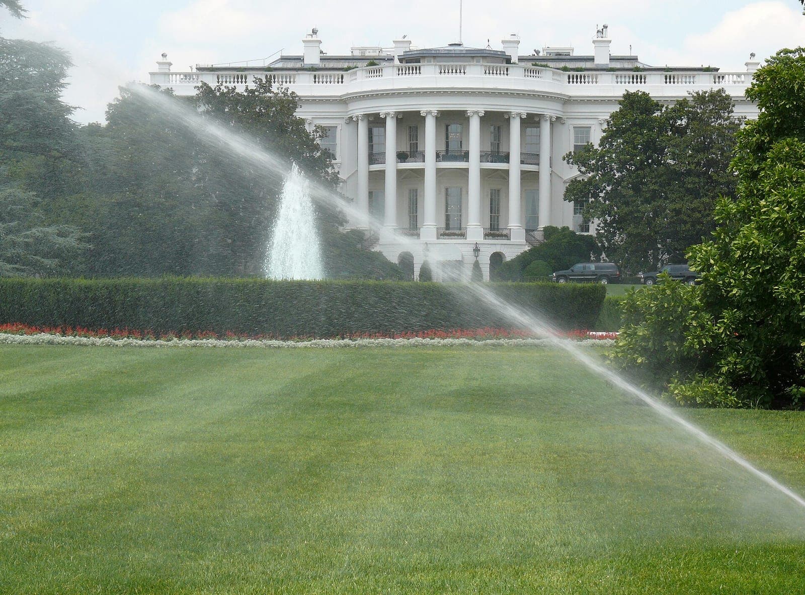 The South facade of the White House, seen across the lawn with a fountain in front