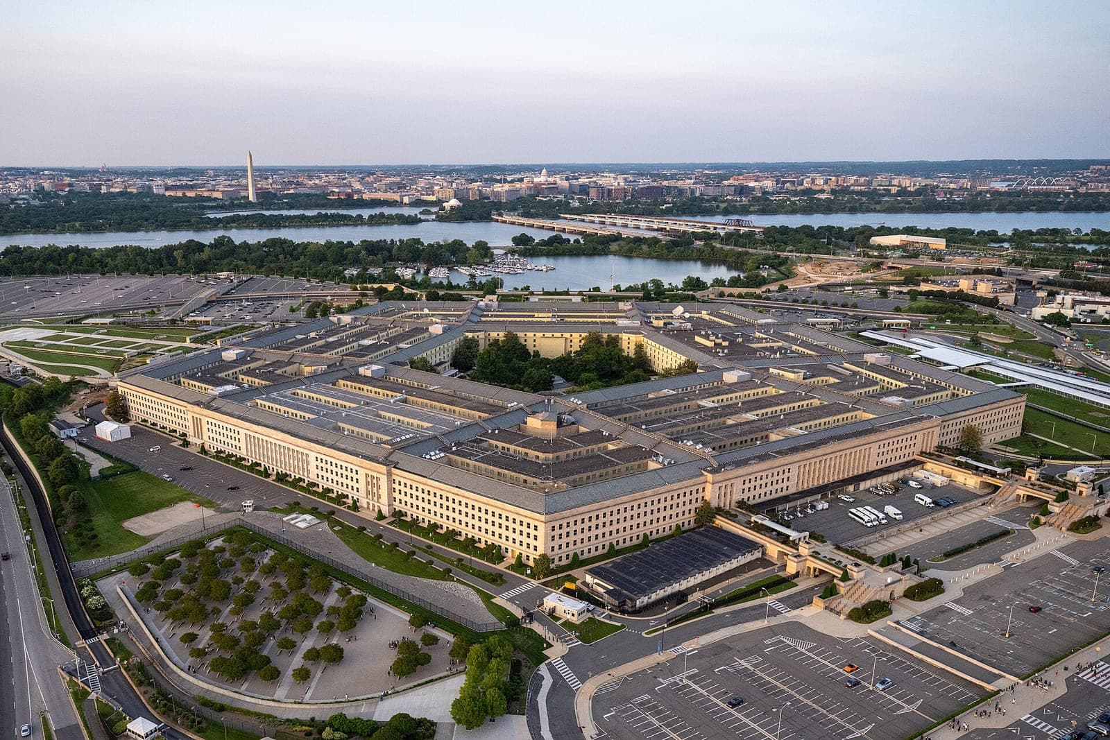 Aerial view of the Pentagon building with the Washington Monument and Capitol visible in the background
