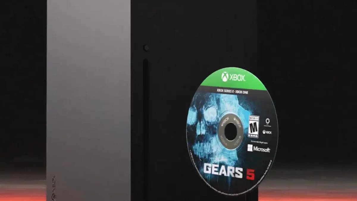 An Xbox Series X console with a Gears 5 game disc being inserted into the disc drive